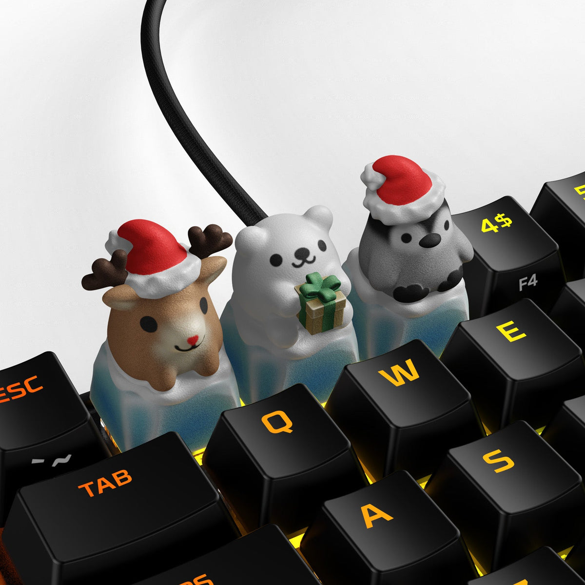 A set of HX3D keycaps featuring holiday-themed characters, including a reindeer and polar bears, placed on a keyboard with illuminated keys.